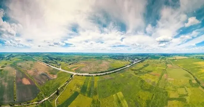 Framed Print : Summer rural landscape with a beautiful sky. Aerial view. View of green fields, village, and highway Framed Print : Summer rural landscape with a beautiful sky. Aerial view. View of green fields, village, and highway