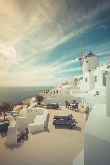 Framed Print : Summer travel destinations. Picturesque cityscape of Oia village in Santorini island located volcanic caldera. Traditional windmills, luxury vacation Framed Print : Summer travel destinations. Picturesque cityscape of Oia village in Santorini island located volcanic caldera. Traditional windmills, luxury vacation