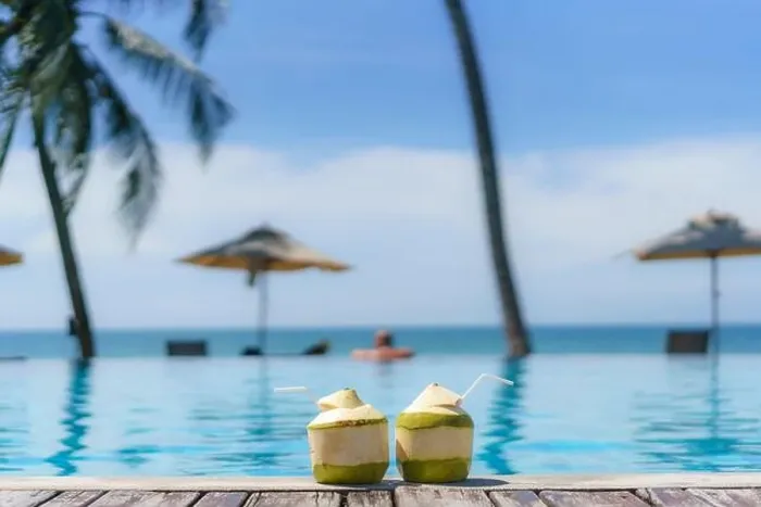 Framed Print : Summer, Travel, Vacation and Holiday concept - Tropical fresh coconut cocktail with pool and beach in ocean, Phuket, Thailand Framed Print : Summer, Travel, Vacation and Holiday concept - Tropical fresh coconut cocktail with pool and beach in ocean, Phuket, Thailand
