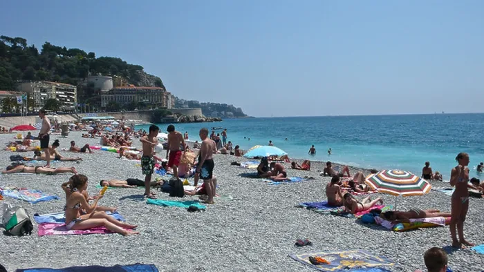 Framed Print : Sunbathers populate the shoreline of the French Riviera Framed Print : Sunbathers populate the shoreline of the French Riviera