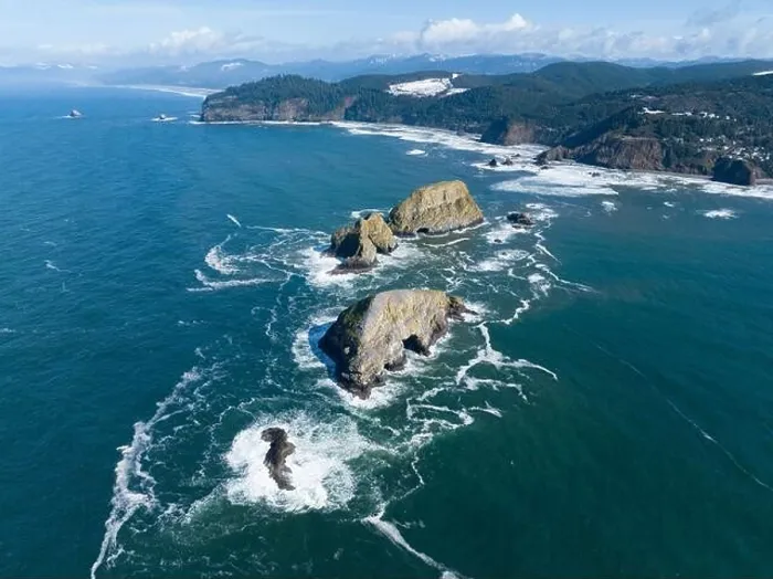 Framed Print : Sunlight shines on rugged sea stacks off the northern coast of Oregon, not far from Tillamook. This coastline has many outstanding viewpoints Framed Print : Sunlight shines on rugged sea stacks off the northern coast of Oregon, not far from Tillamook. This coastline has many outstanding viewpoints
