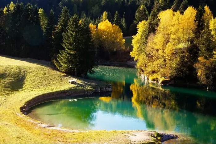 Framed Print : Sunny autumn view of Soraga lake in Soraga di Fassa village, Province of Trento, Italy, Dolomite Alps. Landscape photography