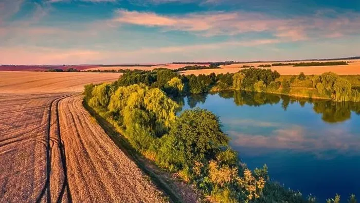 Framed Print : Sunny summer sunset on outskirts of Ternopil town with small pond Framed Print : Sunny summer sunset on outskirts of Ternopil town with small pond