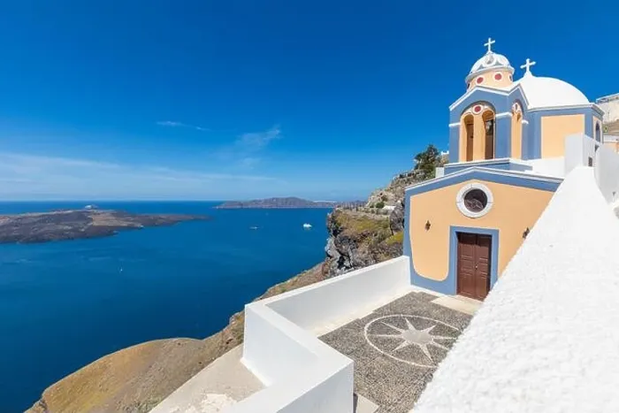 Framed Print : Sunny travel landscape, belltower of a church with a view of Santorini volcanic caldera and ships in it, Santorini, Cyclades, Greece Framed Print : Sunny travel landscape, belltower of a church with a view of Santorini volcanic caldera and ships in it, Santorini, Cyclades, Greece