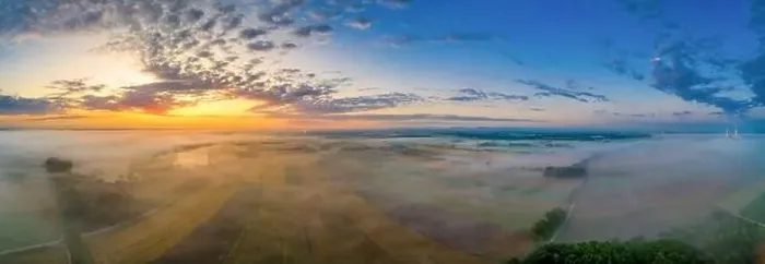 Framed Print : Sunrise glow over a foggy field in bavaria, germany at a wonderful morning in summer Framed Print : Sunrise glow over a foggy field in bavaria, germany at a wonderful morning in summer