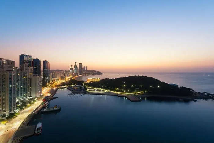 Framed Print : Sunrise at Haeundae beach in Busan. Haeundae beach is Busan's most popular beach in South Korea Framed Print : Sunrise at Haeundae beach in Busan. Haeundae beach is Busan's most popular beach in South Korea