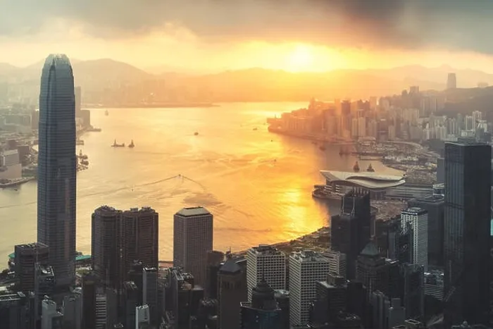 Framed Print : Sunrise over Hong Kong Victoria Harbor from Victoria Peak with Hong Kong and Kowloon below. Asian tourism, modern city life, or business finance and e Framed Print : Sunrise over Hong Kong Victoria Harbor from Victoria Peak with Hong Kong and Kowloon below. Asian tourism, modern city life, or business finance and e