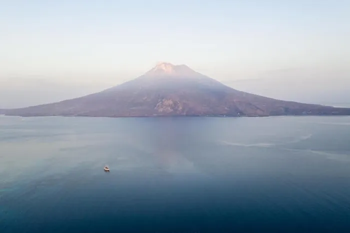 Framed Print : Sunrise illuminates the Iliape volcano found just east of Flores, Indonesia. This tropical area is part of the famous Ring of Fire Framed Print : Sunrise illuminates the Iliape volcano found just east of Flores, Indonesia. This tropical area is part of the famous Ring of Fire
