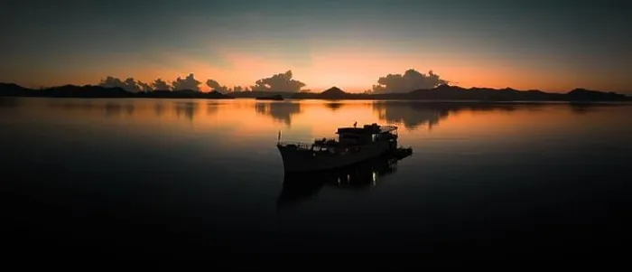 Framed Print : Sunrise illuminates the sky over the calm waters of the Solomon Islands. This scenic region is known for its spectacular marine biodiversity