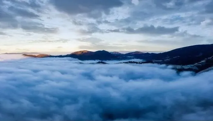 Framed Print : Sunrise over mountain hils covered with gray mist. Aerial panoramic drone shot Framed Print : Sunrise over mountain hils covered with gray mist. Aerial panoramic drone shot