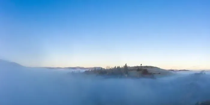 Framed Print : Sunrise over mountain hils covered with gray mist. Aerial panoramic drone shot Framed Print : Sunrise over mountain hils covered with gray mist. Aerial panoramic drone shot