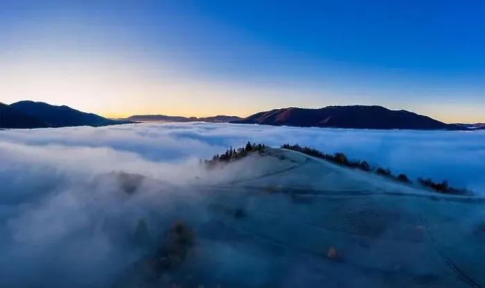 Framed Print : Sunrise over mountain hils covered with gray mist. Aerial panoramic drone shot Framed Print : Sunrise over mountain hils covered with gray mist. Aerial panoramic drone shot
