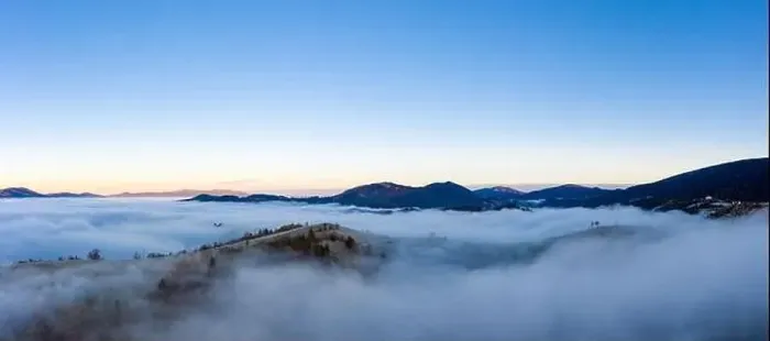 Framed Print : Sunrise over mountain hils covered with gray mist. Aerial panoramic drone shot Framed Print : Sunrise over mountain hils covered with gray mist. Aerial panoramic drone shot