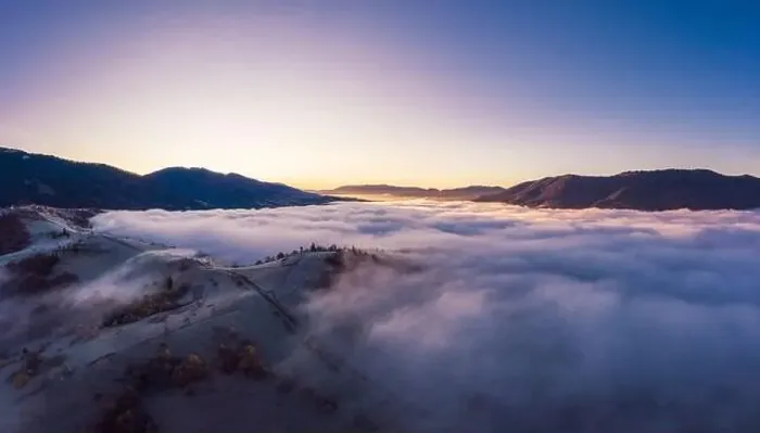 Framed Print : Sunrise over mountain hils covered with gray mist. Aerial panoramic drone shot Framed Print : Sunrise over mountain hils covered with gray mist. Aerial panoramic drone shot