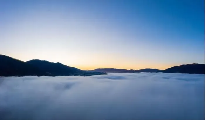 Framed Print : Sunrise over mountain hils covered with gray mist. Aerial panoramic drone shot Framed Print : Sunrise over mountain hils covered with gray mist. Aerial panoramic drone shot