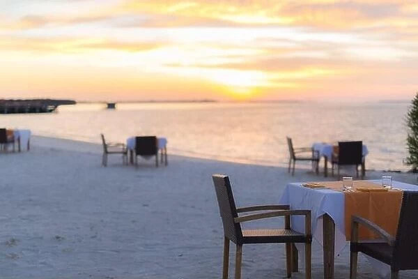 Sunset beach scene tropical restaurant