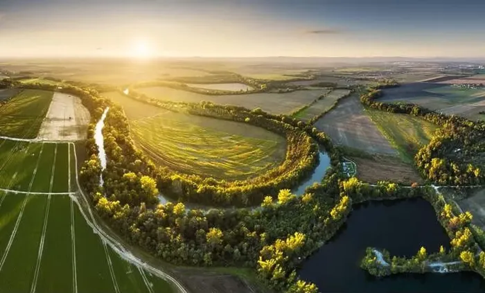 Framed Print : Sunset at Danube river meandering through romantic Slovakia countryside nature landscape Near Senec from drone Framed Print : Sunset at Danube river meandering through romantic Slovakia countryside nature landscape Near Senec from drone