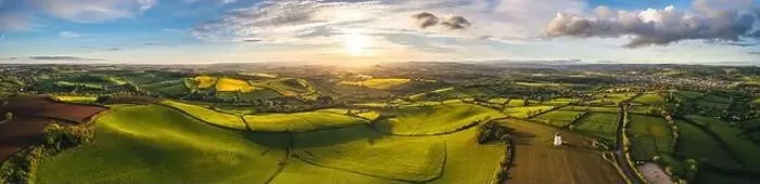 Framed Print : Sunset over Fields and Farmlands in spring from a drone, Devon, England, Europe Framed Print : Sunset over Fields and Farmlands in spring from a drone, Devon, England, Europe