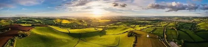 Framed Print : Sunset over Fields and Farmlands in spring from a drone, Devon, England, Europe Framed Print : Sunset over Fields and Farmlands in spring from a drone, Devon, England, Europe