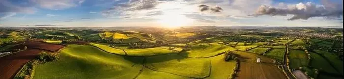 Framed Print : Sunset over Fields and Farmlands in spring from a drone, Devon, England, Europe Framed Print : Sunset over Fields and Farmlands in spring from a drone, Devon, England, Europe