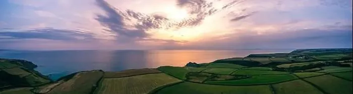 Framed Print : Sunset over Fields and Farms of Caunter Beach and Cliffs Framed Print : Sunset over Fields and Farms of Caunter Beach and Cliffs