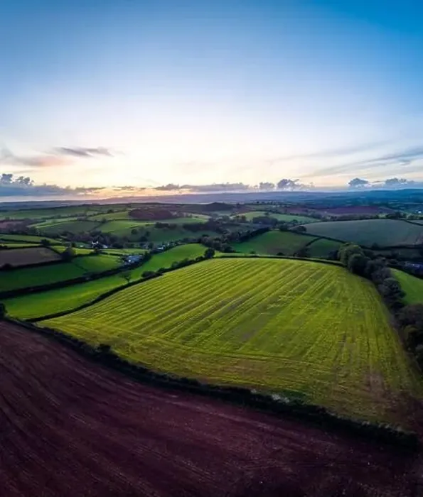 Framed Print : Sunset over Fields and Farms from a drone, Devon, England, Europe Framed Print : Sunset over Fields and Farms from a drone, Devon, England, Europe