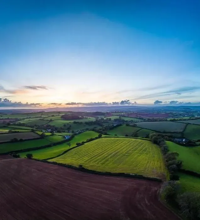 Framed Print : Sunset over Fields and Farms from a drone, Devon, England, Europe Framed Print : Sunset over Fields and Farms from a drone, Devon, England, Europe