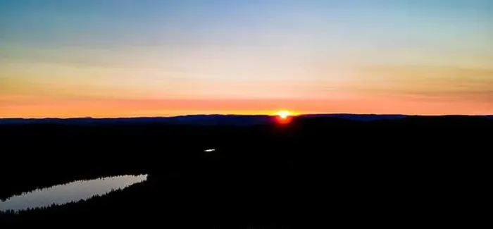 Framed Print : Sunset over the hills in a boreal wild forest in Scandinavia.. High quality photo