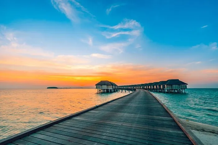 Framed Print : Sunset landscape on Maldives island beach, water villas resort. Beautiful sky and clouds Framed Print : Sunset landscape on Maldives island beach, water villas resort. Beautiful sky and clouds