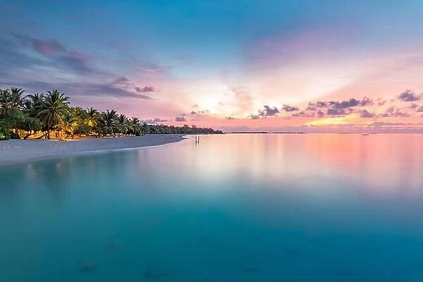 Sunset landscape of paradise tropical island beach. Tranquil colorful sky with seascape reflection. Exotic summer nature scenery, coastline, shore