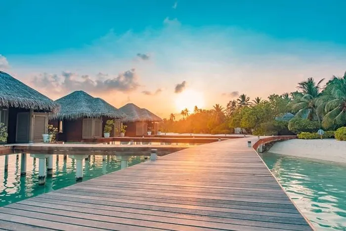 Framed Print : Sunset on Maldives island, luxury water villas resort and wooden pier. Beautiful sky clouds and beach background for summer vacation holiday travel Framed Print : Sunset on Maldives island, luxury water villas resort and wooden pier. Beautiful sky clouds and beach background for summer vacation holiday travel