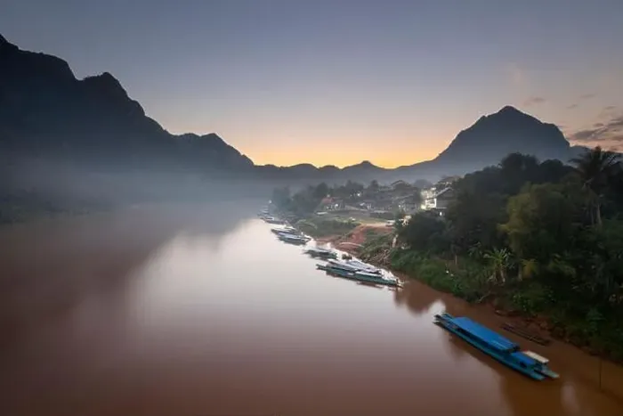 Framed Print : Sunset over the misty Nam Ou River at the village of Nong Khiaw Framed Print : Sunset over the misty Nam Ou River at the village of Nong Khiaw