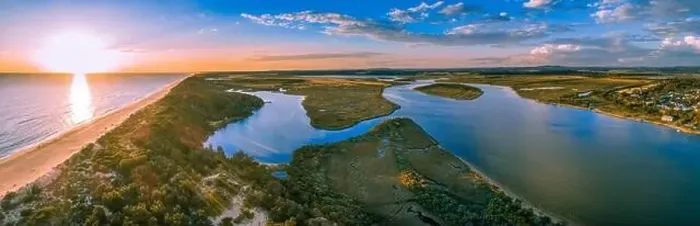 Framed Print : Sunset over ocean and Snowy River - wide aerial panoramic landscape