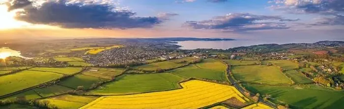 Framed Print : Sunset over Rapeseed fields and Farmlands from a drone, Paignton and Brixham, River Dart, Devon, England Framed Print : Sunset over Rapeseed fields and Farmlands from a drone, Paignton and Brixham, River Dart, Devon, England