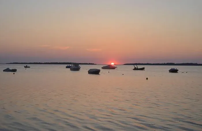 Framed Print : Sunset with red sun over the german Salzhaff at the baltic sea, view to somes boat silhouettes Framed Print : Sunset with red sun over the german Salzhaff at the baltic sea, view to somes boat silhouettes