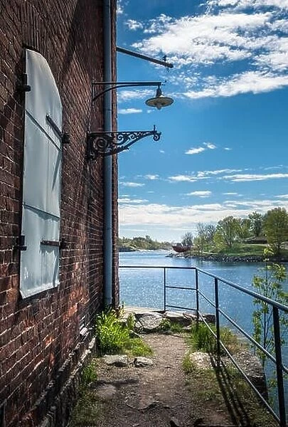 SUOMENLINNA, HELSINKI, FINLAND - MAY 26, 2017: Scenic summer view of Suomenlinna, Finland with sea and idyllic buildings at bright day