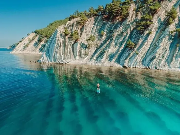 Framed Print : SUP boarding in Mediterranean sea with mountain coastline. Aerial view Framed Print : SUP boarding in Mediterranean sea with mountain coastline. Aerial view