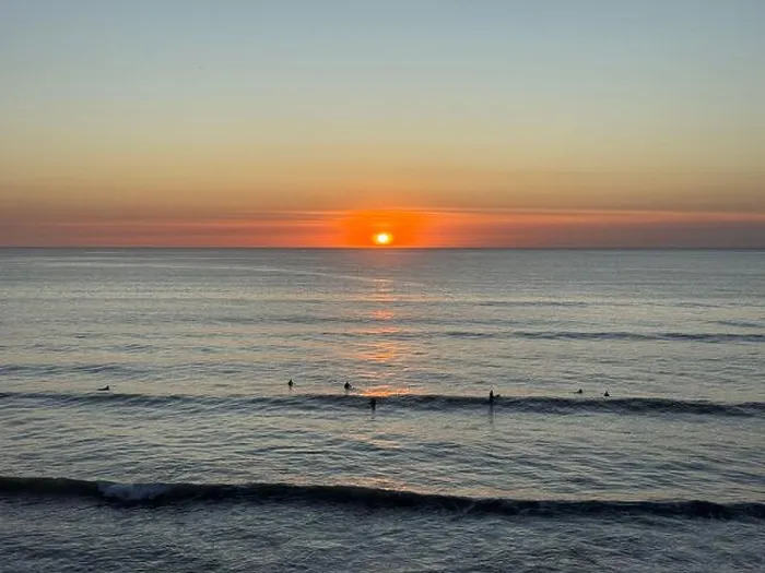 Framed Print : Surfers at Sunset, Widemouth Bay, North Cornwall, England, UK Framed Print : Surfers at Sunset, Widemouth Bay, North Cornwall, England, UK