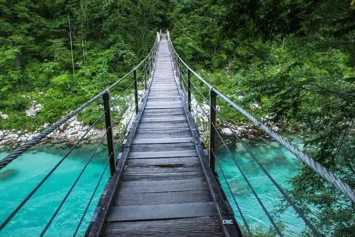 Framed Print : Suspension bridge in Soca valley over Soca river in Slovenia Framed Print : Suspension bridge in Soca valley over Soca river in Slovenia