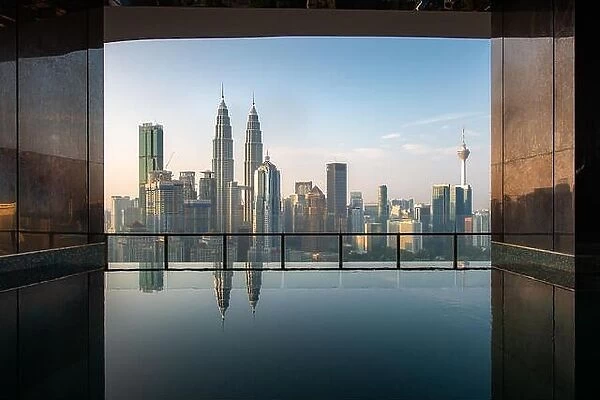 Swimming pool on roof top with beautiful city view in morning at Kuala lumpur, Malaysia. Travel and Vacation concept