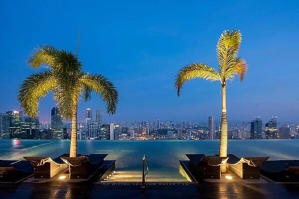 Swimming Pool on roof top and Singapore city skyline in night, Sinagpore