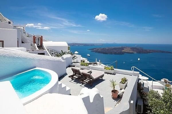 Swimming poolside, infinity pool relaxation view out over the sea caldera of Santorini Greece. Luxury travel, summer holiday vacation, peaceful resort
