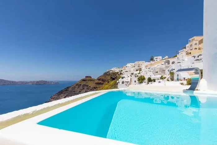 Framed Print : Swimming poolside, infinity pool relaxation view out over the sea caldera of Santorini Greece. Luxury travel, summer holiday vacation, peaceful resort Framed Print : Swimming poolside, infinity pool relaxation view out over the sea caldera of Santorini Greece. Luxury travel, summer holiday vacation, peaceful resort