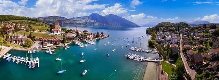 Framed Print : Switzerland. aerial drone panorama of lake Thun and the Spiez village with medieval castle and old town. cantone Bern Framed Print : Switzerland. aerial drone panorama of lake Thun and the Spiez village with medieval castle and old town. cantone Bern