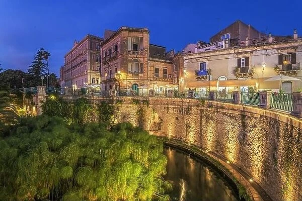 Syracuse, Sicily, Italy with the Fountain of Arethusa at dusk