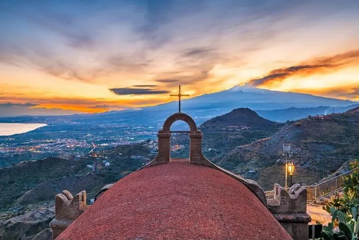 Framed Print : Taormina, Sicily, Italy with the ancient Church of San Biagio and Mt. Etna at dusk Framed Print : Taormina, Sicily, Italy with the ancient Church of San Biagio and Mt. Etna at dusk
