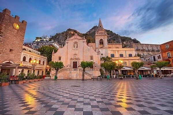 Taormina, Sicily, Italy. Cityscape image of picturesque town of Taormina, Sicily with main square Piazza IX Aprile and San Giuseppe church at sunrise