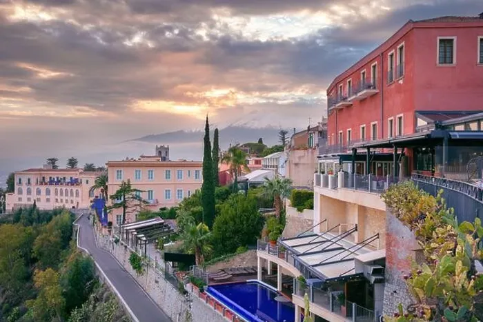 Framed Print : Taormina, Sicily, Italy. Cityscape image of picturesque town of Taormina, Sicily with volcano Mt. Etna in the background at sunset Framed Print : Taormina, Sicily, Italy. Cityscape image of picturesque town of Taormina, Sicily with volcano Mt. Etna in the background at sunset