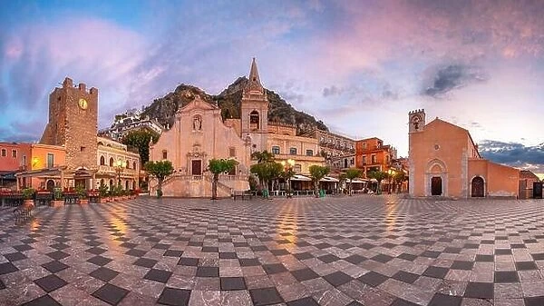 Taormina, Sicily, Italy. Panoramic cityscape image of picturesque town of Taormina, Sicily with main square Piazza IX Aprile and San Giuseppe church a
