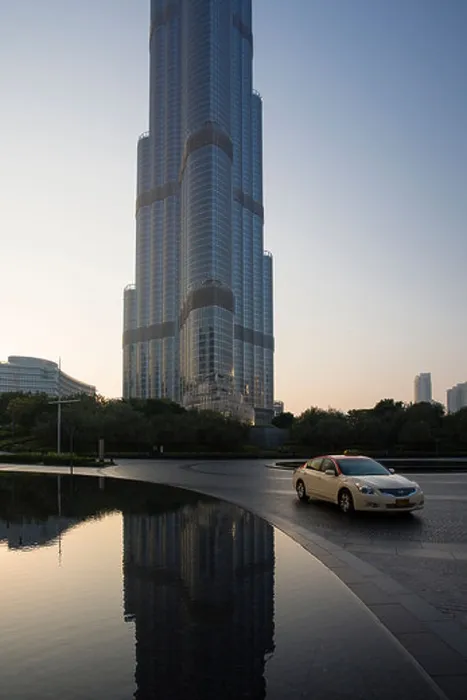 Framed Print : A taxi passes by the Burj Khalifa tower in Dubai, United Arab Emirates Framed Print : A taxi passes by the Burj Khalifa tower in Dubai, United Arab Emirates
